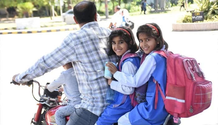 Young girls are leaving to their homes after school time in Islamabad on May 10, 2023. — Online