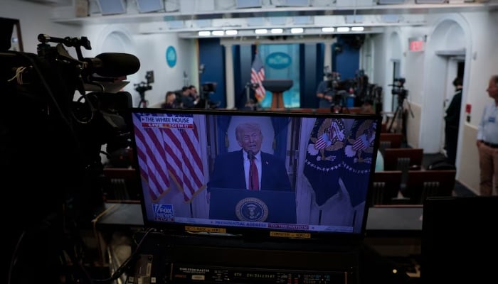 Journalists at the White House listen as US President Donald Trump delivers an address to the nation about the Iran war, in Washington, DC, US, April 1, 2026. — Reuters