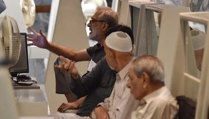 Stockbrokers monitor stock prices at the Pakistan Stock Exchange (PSX) in Karachi, April 7, 2025. — INP