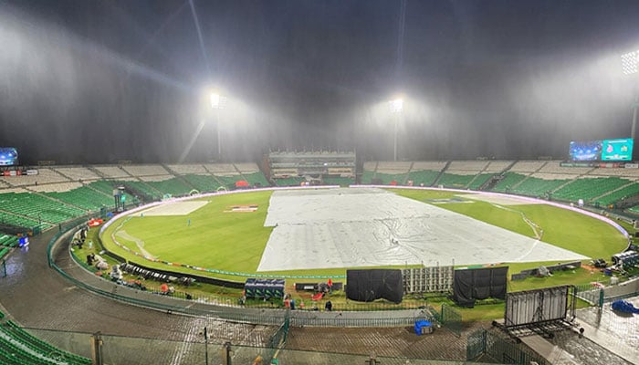 Ground covered with tarpaulins at Gaddafi Stadium, Lahore, after rain ahead of PSL 11 clash between Lahore Qalandars and Multan Sultans on April 3, 2026. — PSL