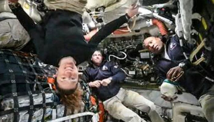 This screen grab from Nasas feed released on April 3, 2026, shows the four Artemis II crew members (L-R) Canadian Space Agency (CSA) astronaut Jeremy Hansen, Artemis II mission specialist (hidden), Nasa astronauts Reid Wiseman, Artemis II commander, Christina Koch, Artemis II mission specialist and Victor Glover, Artemis II pilot as they head to orbit the Moon for the first time in more than half a century. — AFP