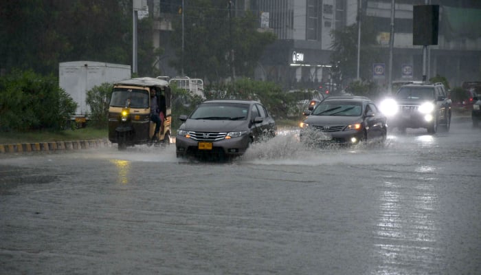 Motorists drive during heavy rainfall in Karachi on April 2, 2026. — Online