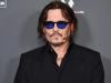 Johnny Depp promotes new brand at L.A. red carpet