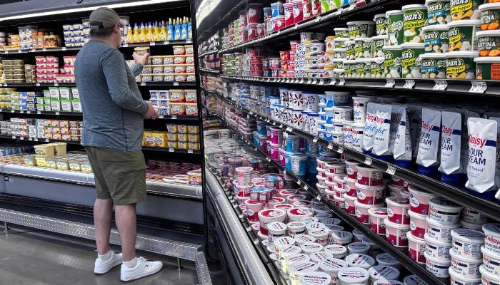 A man shops for butter at a supermarket in Houston, Texas, on March 17, 2026. — AFP