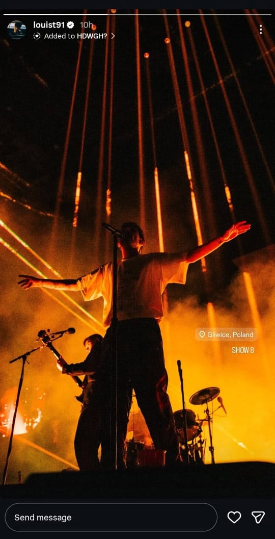 Louis Tomlinson commands the stage in amber glow at Show 8