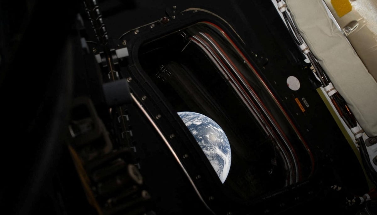 A view of Earth taken by Nasa astronaut and Artemis II commander Reid Wiseman from one of the Orion spacecrafts four main windows after completing the translunar injection burn as the crew makes its way towards the moon, April 2, 2026. — Reuters