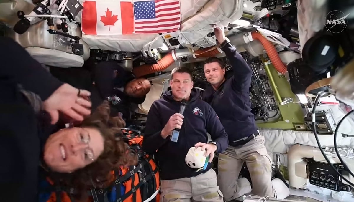This screengrab taken from a NASA livestream shows Artemis II mission astronauts (L-R) Nasa´s pilot Victor Glover, Nasa commander Reid Wiseman, Canadian Space Agency´s mission specialist Jeremy Hansen and Nasa´s mission specialist Christina Koch as they attend a VIP call with Canadian children from inside the Orion spacecraft while on his way to the moon on April 4, 2026. — AFP