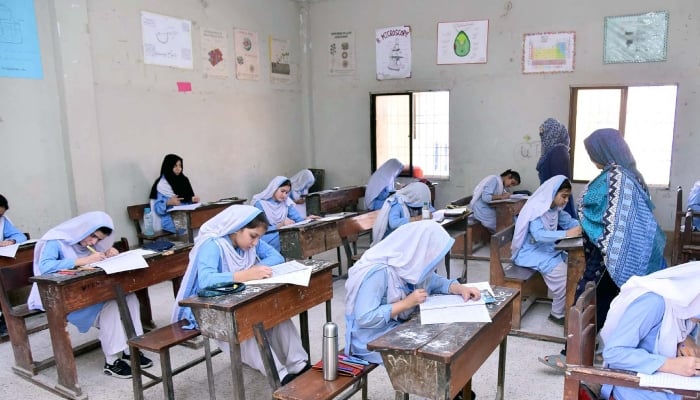 Students solving paper in examination center during annual examination of matriculation under the Board of Intermediate and Secondary Education (BISE), located on North Nazimabad area in Karachi, April 16, 2025. — PPI