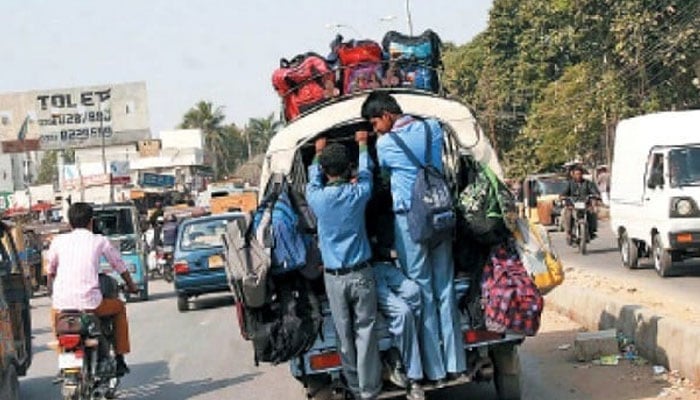 Students are seen commuting on an overloaded van. — Online/File
