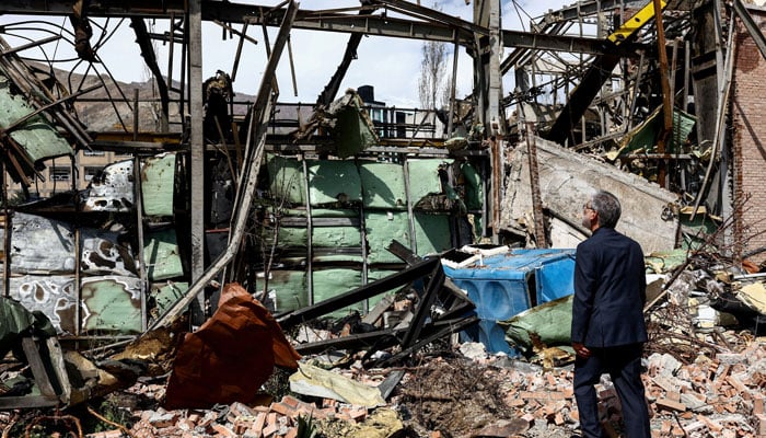 Irans Minister of Science Hossein Simaee Sarraf inspects the damage at the research building of the Shahid Beheshti University, which was damaged by a strike, amid the US-Israeli conflict with Iran, in Tehran, Iran, April 4, 2026. — Reuters