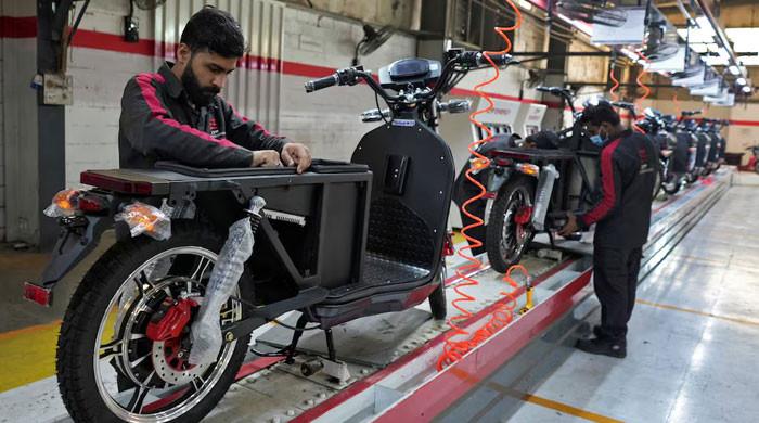 Soaring costs, fuel shortage fears drive Pakistan to electric motorbikes