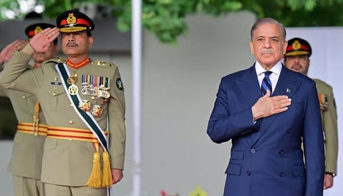 Prime Minister Shehbaz Sharif and Chief of Army Staff Asim Munir review a passing out parade at the Pakistan Military Academy (PMA) Kakul, in Abbottabad on April 26. — AFP