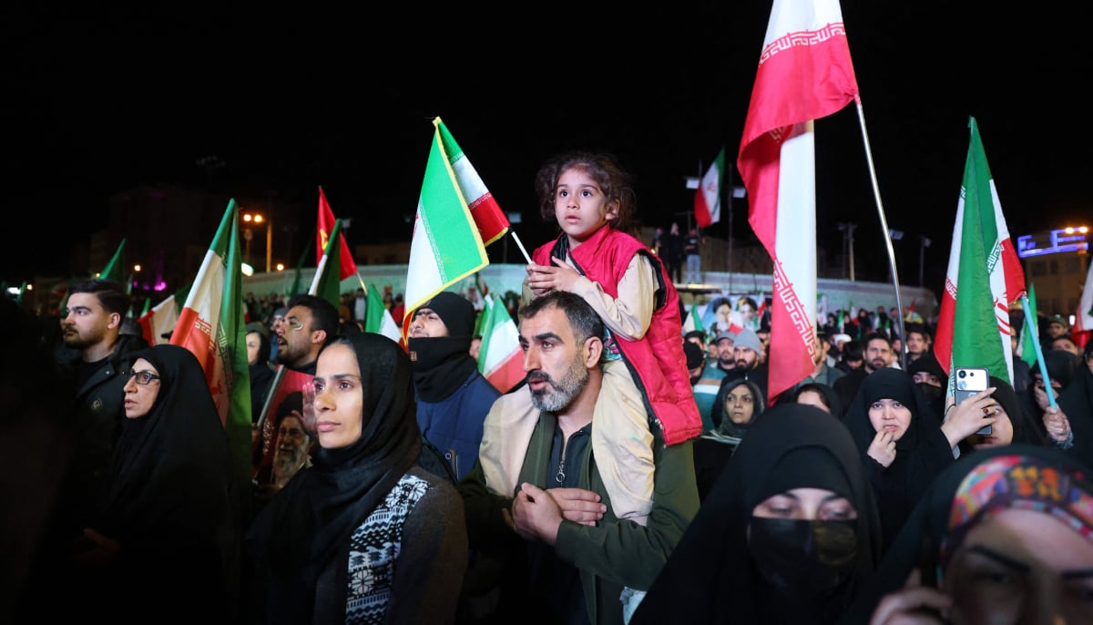 Iranians react after a ceasefire announcement at the Enqelab square, in Tehran, on April 8 2026. — AFP