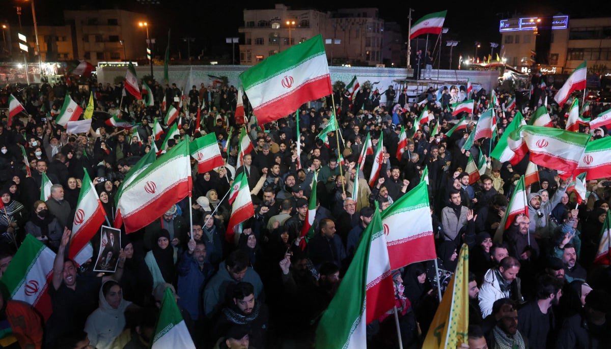 Iranians react after a ceasefire announcement at the Enqelab square, in Tehran, on April 8 2026. — AFP