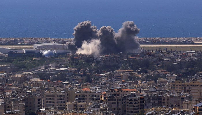 Smoke rises following an Israeli strike on the southern suburbs of Beirut, as seen from Baabda, Lebanon, April 8, 2026. — Reuters