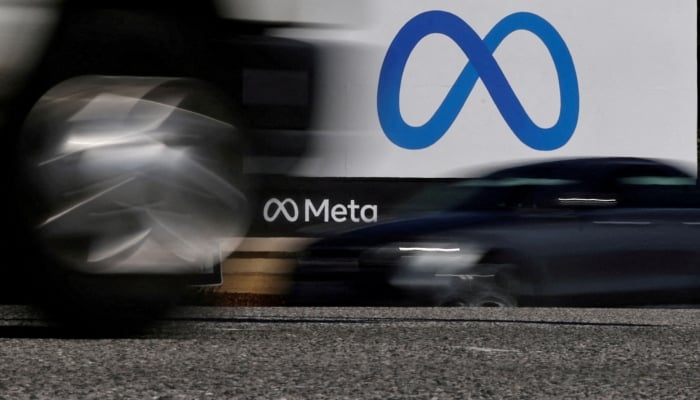 Cars drive past a sign of Meta, the new name for the company formerly known as Facebook, at its headquarters in Menlo Park, California, US. — Reuters/File
