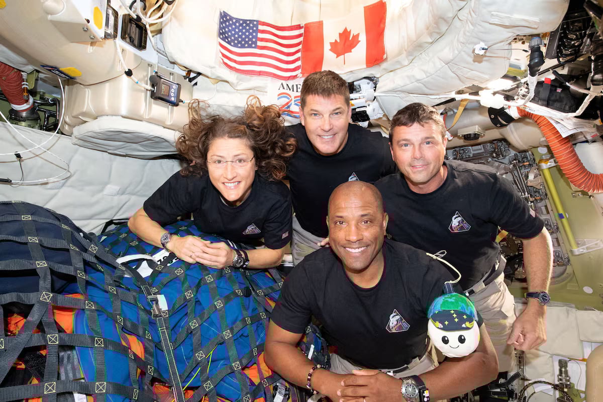 The NASA Artemis II crew, Mission Specialist Christina Koch, Mission Specialist Jeremy Hansen, Commander Reid Wiseman, and Pilot Victor Glover, pose for a group photo inside the Orion spacecraft on their way home following a flyby of the far side of the Moon on April 6, 2026. — Reuters