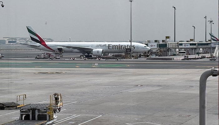 An Emirates airplane at Dubai International Airport, amid the US-Israeli conflict with Iran, in Dubai, United Arab Emirates, March 8, 2026. — Reuters