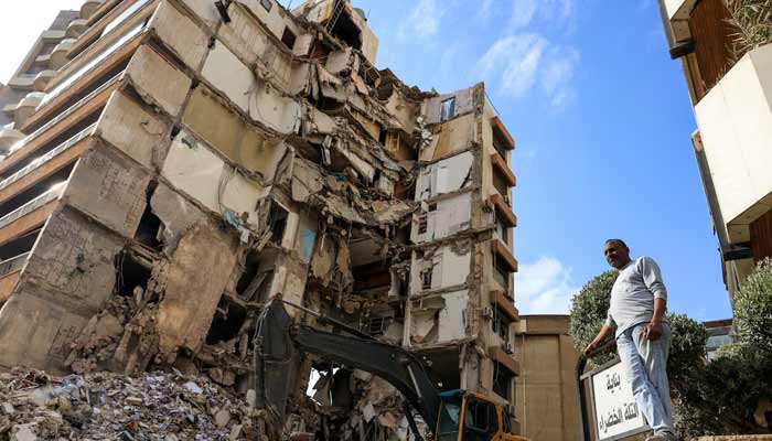 A man stands near a damaged building at the site of an Israeli strike carried out on Wednesday, in Tallet El Khayat in Beirut, Lebanon, April 9, 2026.— Reuters/File