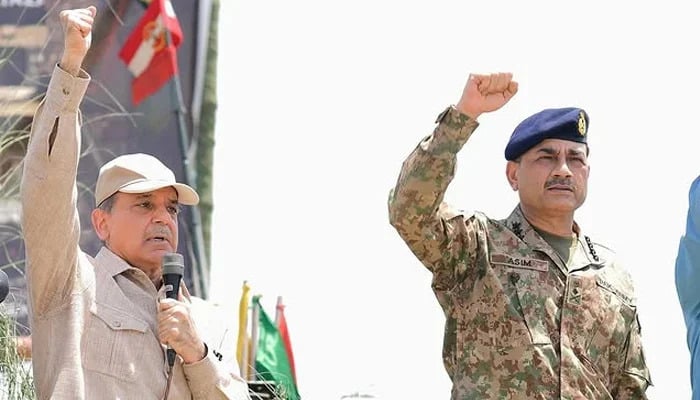 Prime Minister Shehbaz Sharif and Chief of Army Staff (COAS) General Asim Munir gesture in this image taken on their visit to meet members of the armed forces who took part in Operation Bunyan-um-Marsoos against India. — Instagram/shehbazsharif