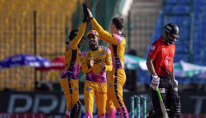 Peshawar Zalmi players celebrate after dismissing Lahore Qalandars Fakhar Zaman during their Pakistan Super League (PSL) 11 match at the National Bank Stadium in Karachi on April 11, 2026. — PSL