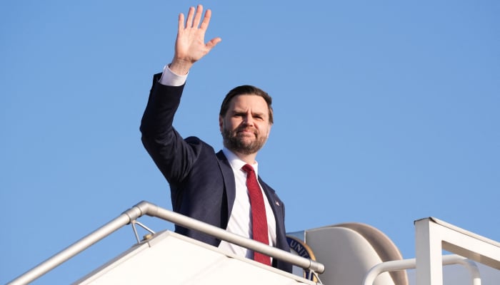 US Vice President JD Vance waves as he boards Air Force Two after attending talks on Iran in Islamabad on April 12, 2026. — AFP