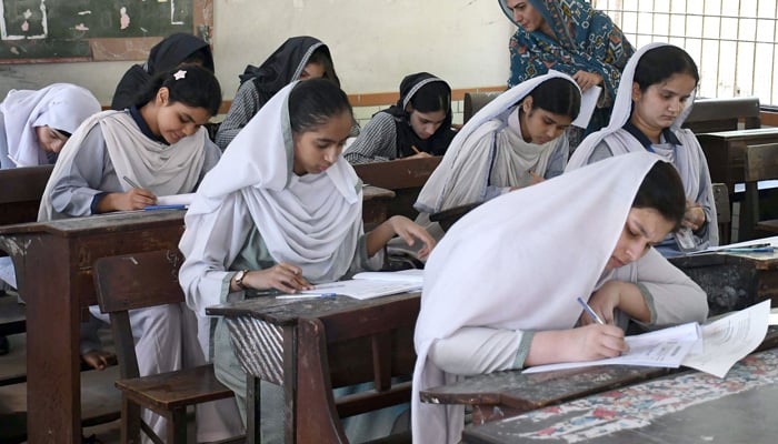 Students solve their question papers during the annual matriculation (9th and 10th grade) examinations in Karachi on April 10, 2026. — Online