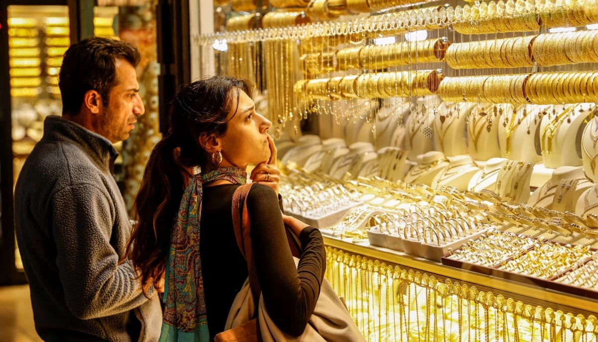 People look at gold jewelleries as they stand outside a jewellery shop at the Grand Bazaar in Istanbul, Turkey, January 26, 2026. — Reuters