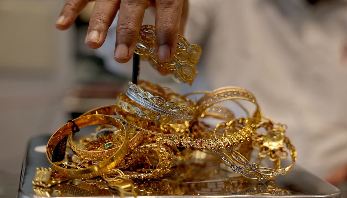 A goldsmith weighs gold jewellery inside a showroom in Ahmedabad, India, July 31, 2025. — Reuters