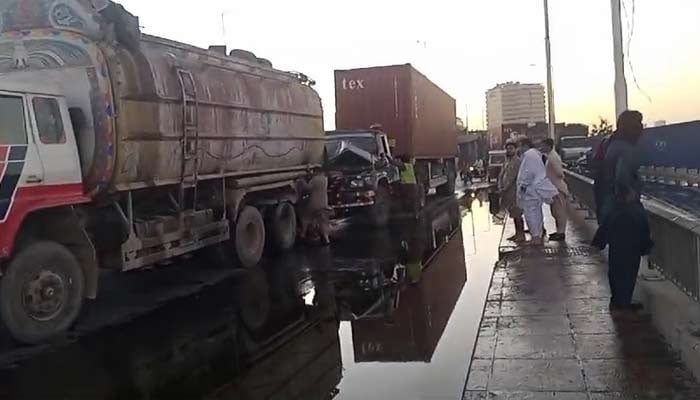 Heavy vehicles can be seen stuck in a traffic jam on Karachis busy Native Jetty Bridge. — Geo News/File