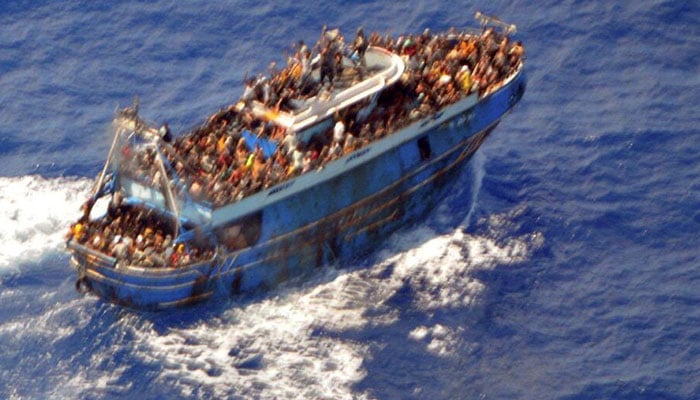 An undated handout photo provided by the Hellenic Coast Guard shows migrants onboard a boat during a rescue operation, before their boat capsized on the open sea, off Greece, June 14, 2023. — Reuters