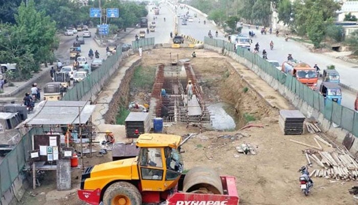 Development work of Red Line is underway on University Road in Karachi. — APP/File