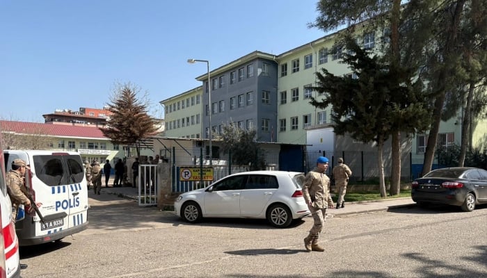 This handout photograph released by Turkish news agency DHA (Demiroren News Agency) shows special force security surrounding a school in southeastern Turkiye. — AFP/File