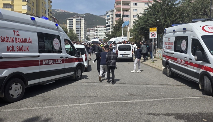 This handout photograph taken and released on April 15, 2026 by Turkish news agency DHA (Demiroren News Agency) shows first aid officers ambulances parking next to a school in Kahramanmaras, southern Turkiye. — AFP