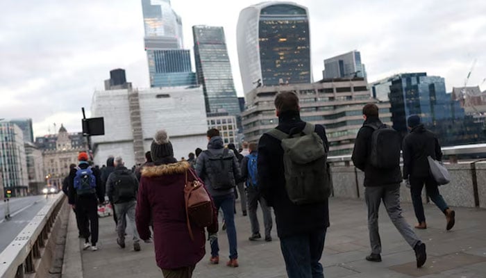 This representational image shows commuters cross London Bridge, in London, Britain, January 13, 2025. — Reuters
