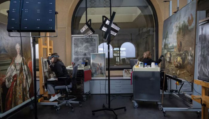 Art restorers work at painting restoration department of the Prado museum in Madrid on October 7, 2025. — AFP