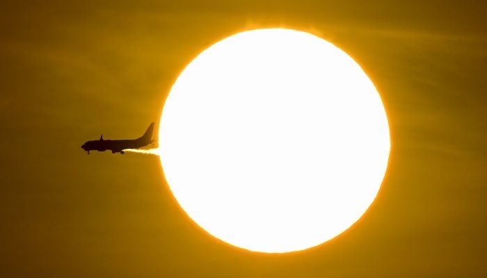 Threat of grounded planes nears as jet fuel supplies dwindle 10 An airplane passes in front of the sun during sunrise in Panama City on April 15, 2026. — AFP