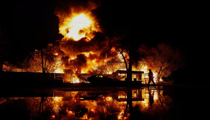 A firefighter works at the site of recycling materials hit by a Russian missile strike, amid Russias attack on Ukraine, in Kyiv, Ukraine, April 16, 2026. — Reuters