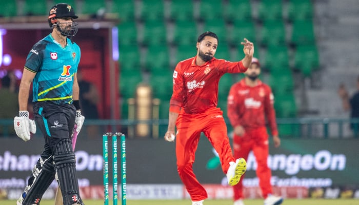 Islamabad United all-rounder Faheem Ashraf (right) bowls against Rawalpindiz during PSL match at Gaddafi Stadium in Lahore on April 4, 2026. — PCB