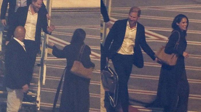 Meghan takes Harry's hand as couple share soft moment on Sydney arrival