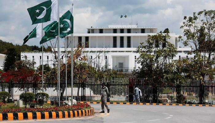 A security guard patrols outside the Aiwan e Sadr (Presidential Palace) ahead of Iran-US talks in Islamabad, April 9, 2026. — Reuters