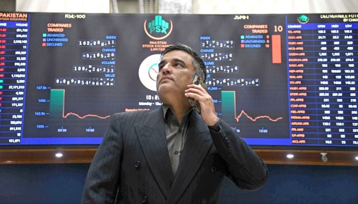 A broker monitors share prices at the Pakistan Stock Exchange (PSX) in Karachi, April 13, 2026. — Online