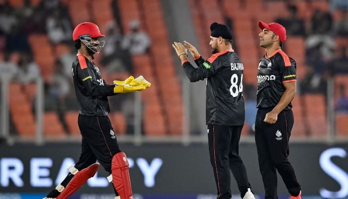 Canadas captain Dilpreet Bajwa (centre) celebrates with teammates after taking the wicket of South Africas Quinton de Kock during their 2026 ICC Mens T20 Cricket World Cup group stage match at the Narendra Modi Stadium, Ahmedabad, February 9, 2026. — AFP
