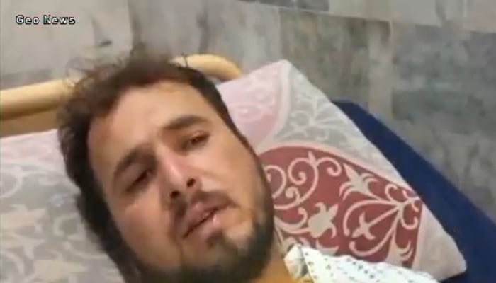 Marble mine worker Abdul Wahab under treatment in a hospital in Mardan. — Video grab Geo News