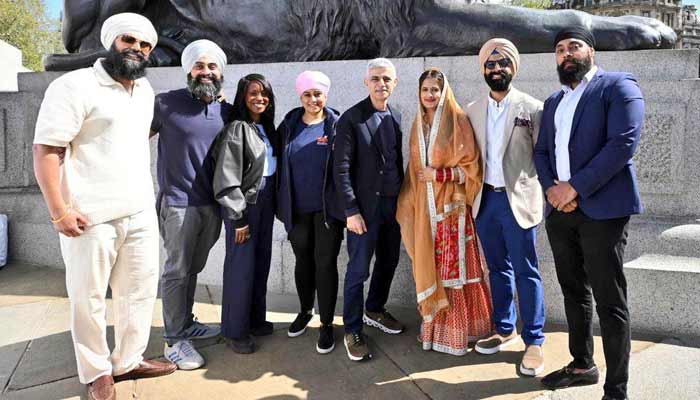 London Mayor poses for a picture with the participants of the Vaisakhi festival in Londons Trafalgar Square. — Reporter