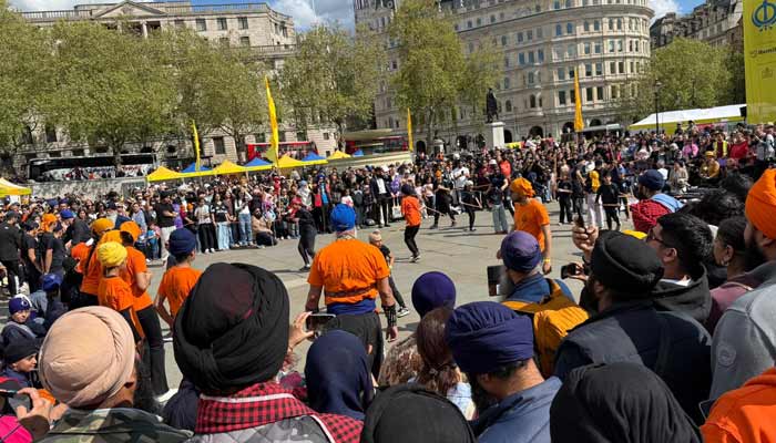 Sikh people gather at Londons Trafalgar Square during Vaisakhi festival. —Reporter