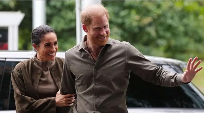 Meghan Markle and Harry appear 'on edge' during crowded museum arrival