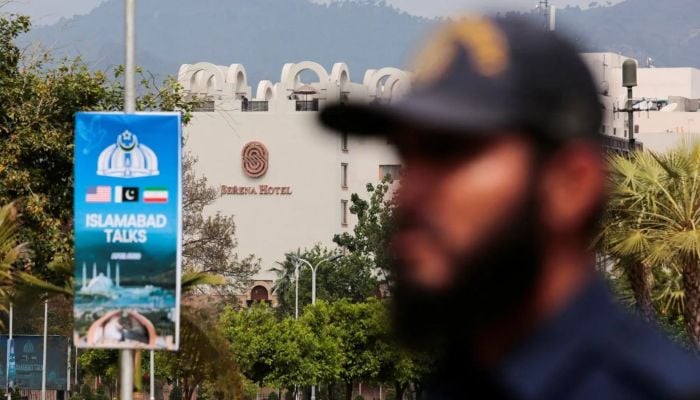 A security personnel stands guard outside the media centre near the road leading to Serena Hotel, in Islamabad, on April 11, 2026. — Reuters