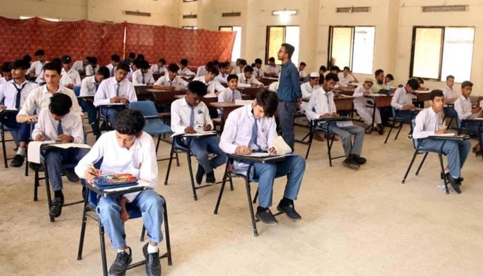 Students of the matric class solve papers in the examination centre during the Annual Examination of Matriculation under the supervision of the Education Board, in Karachi on May 8, 2024. — PPI