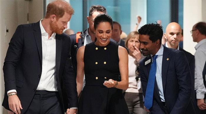 Harry and Meghan's quiet Sydney kiss nearly slipped under the radar